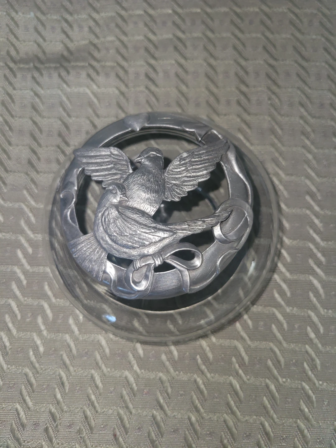 Glass dome with pewter bird figurine lid