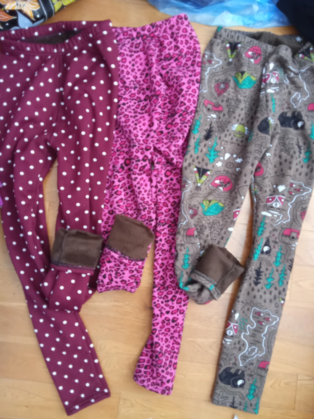 Three pairs of patterned fleece lined leggings