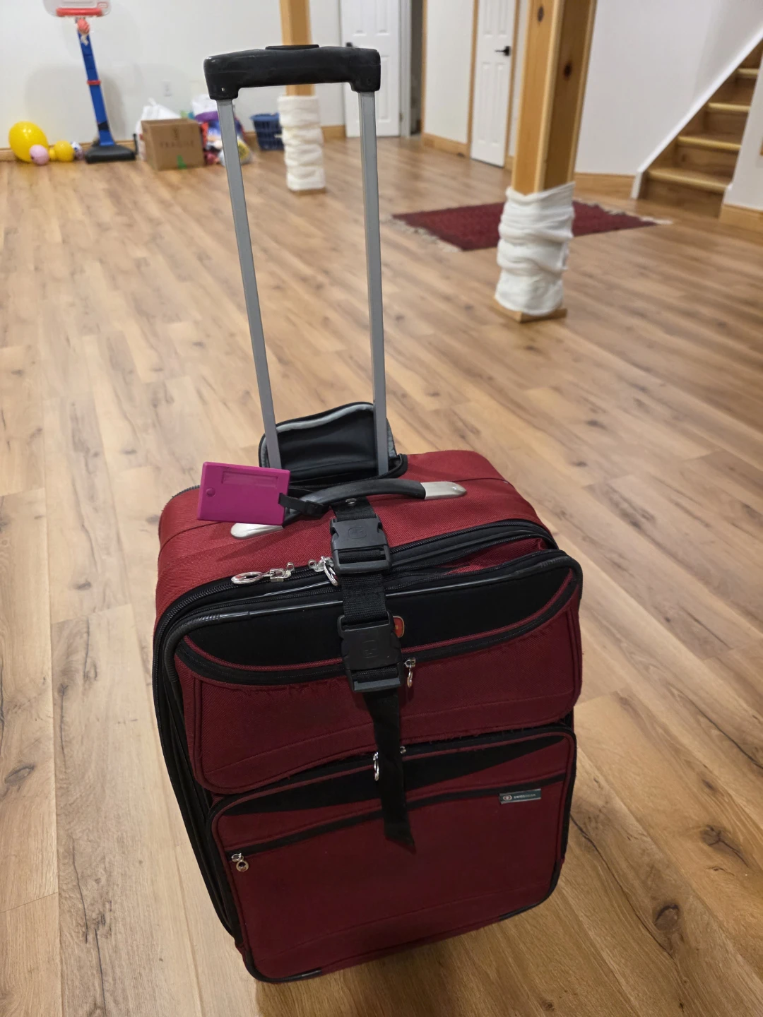 Red Swissgear Rolling Suitcase
