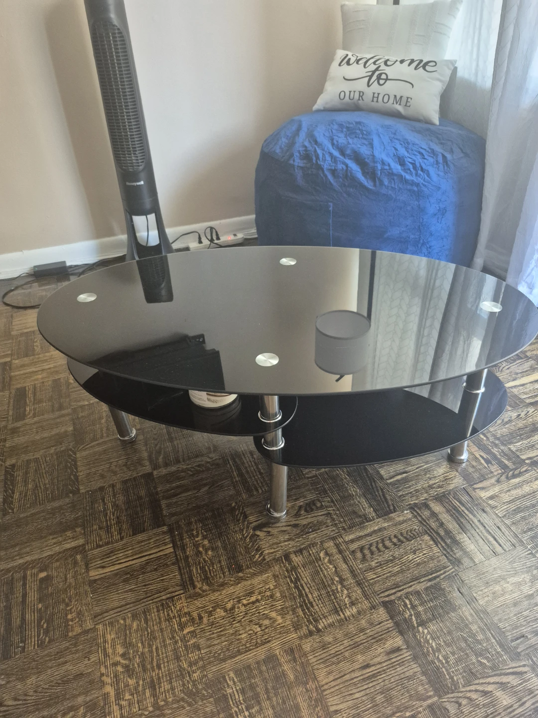 Oval Coffee Table with Black Glass Shelves