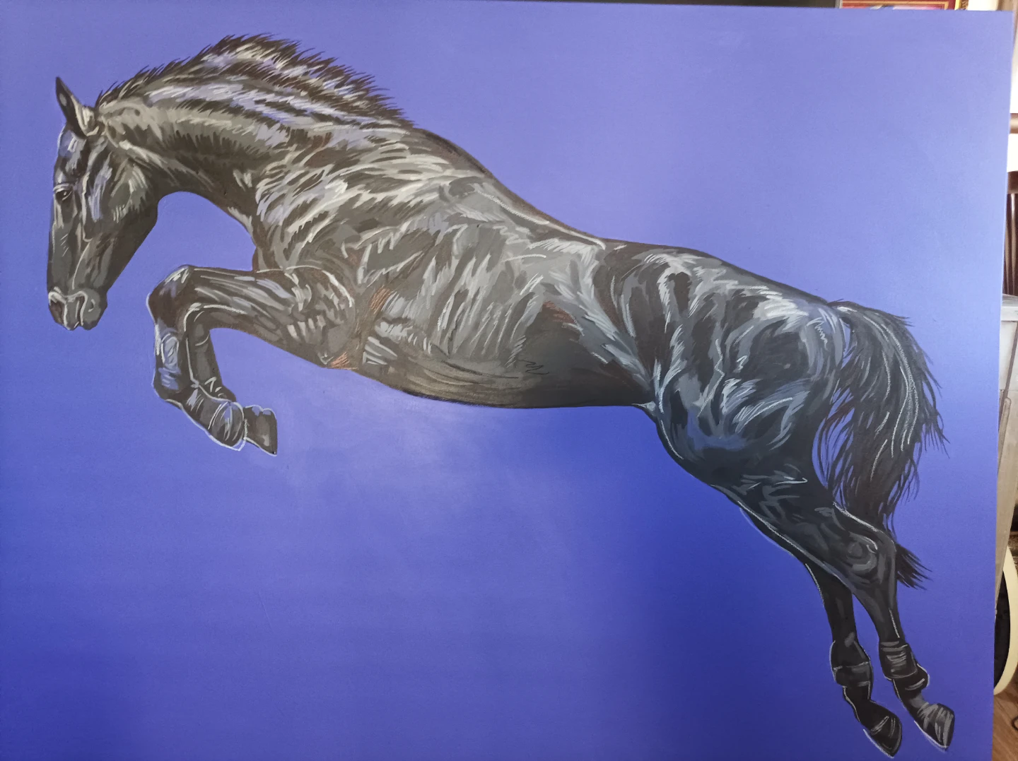 Painting of a black jumping horse