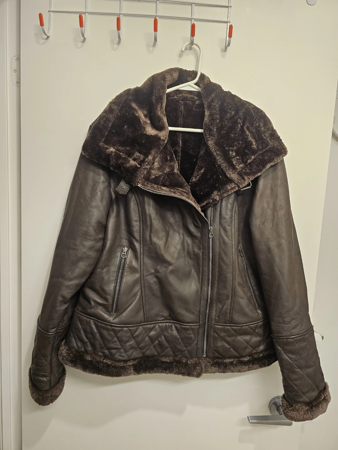 Dark brown leather jacket with faux fur lining
