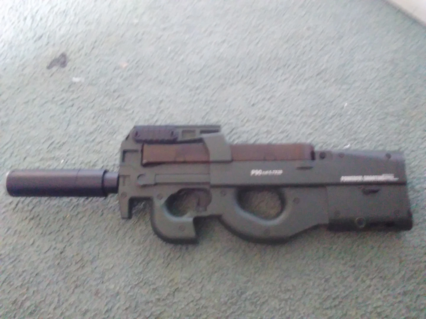Gel blaster p90 with led suppressor attachment and battery