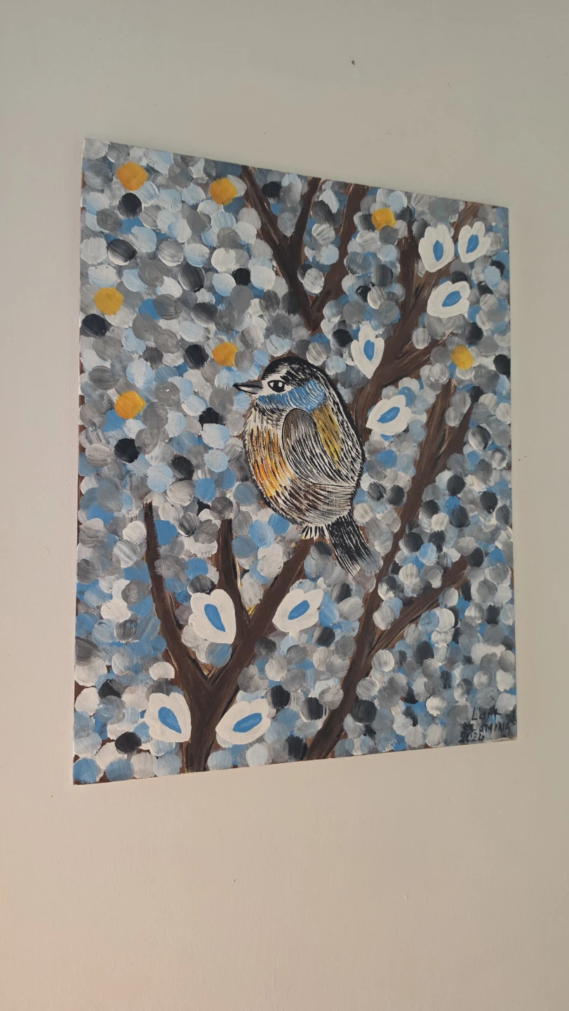 Painting of a bird on a tree branch