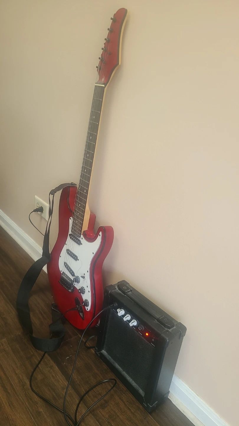 Red Electric Guitar with Amplifier