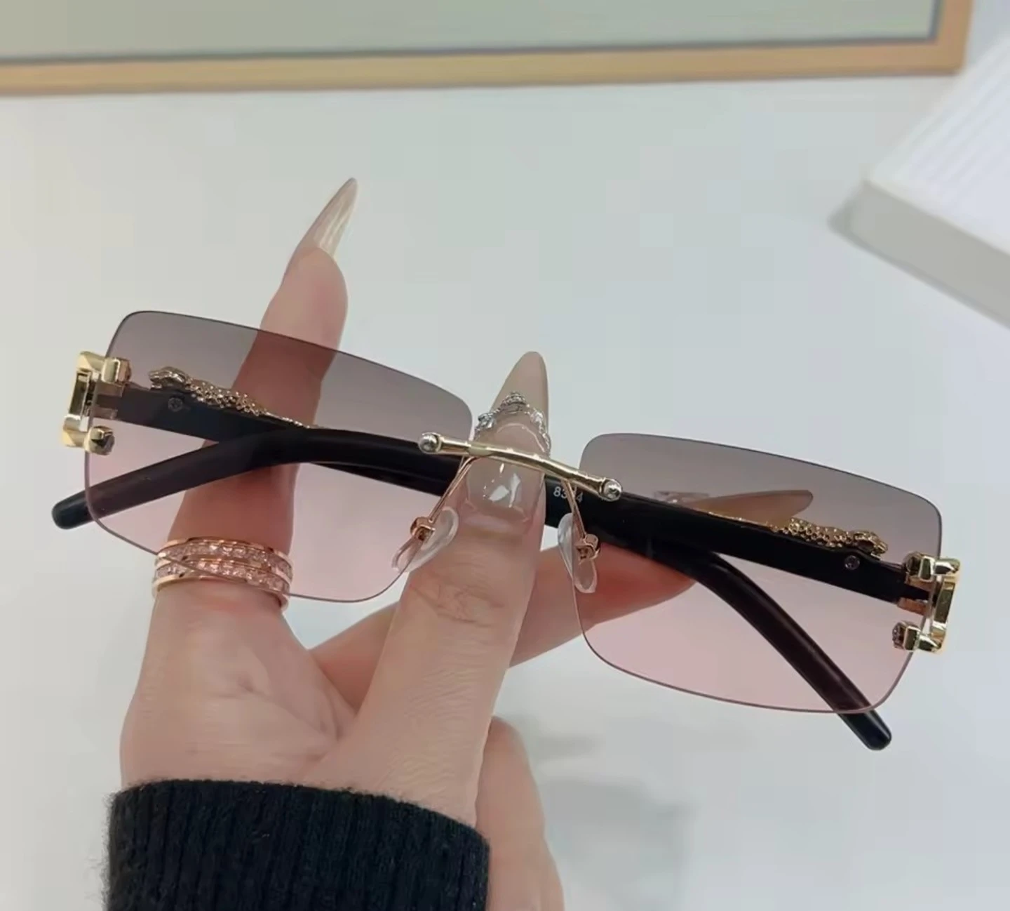 Rimless Sunglasses with Gold Accents and Pink Gradient Lenses