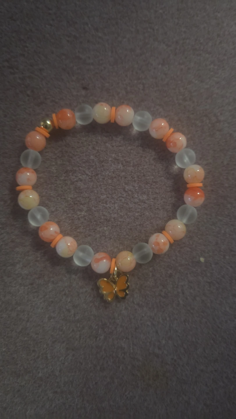 Orange and White Beaded Bracelet with Butterfly Charm