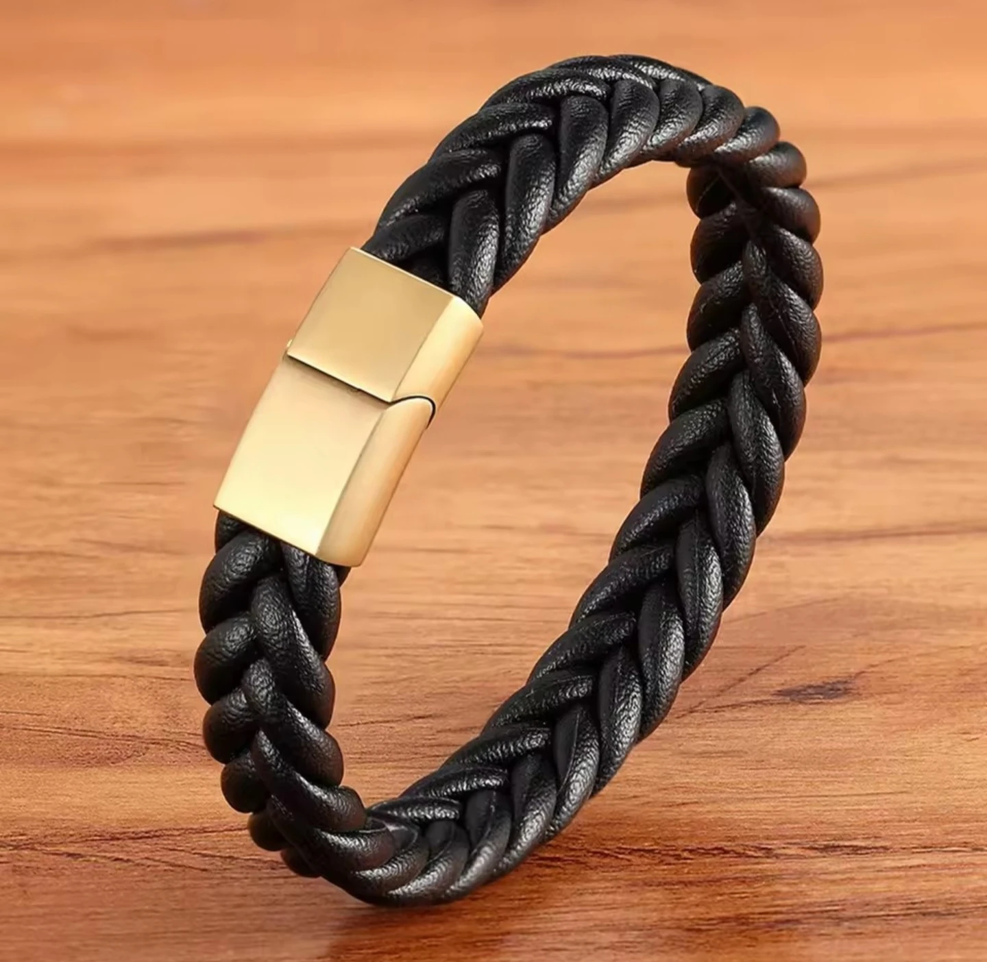 Black braided leather bracelet with gold-tone clasp
