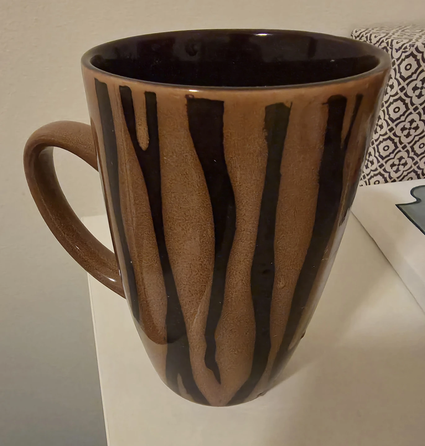 Tall brown and black striped ceramic mug