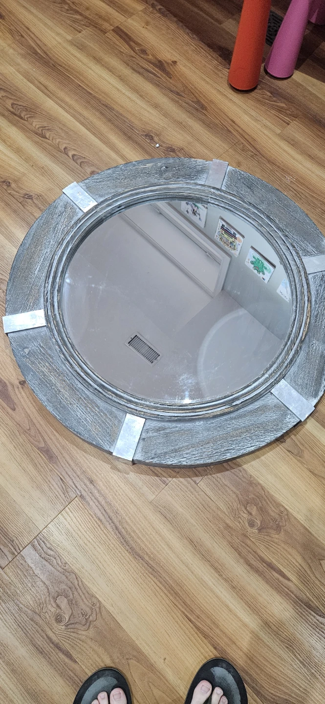 Round rustic wood mirror with metal accents