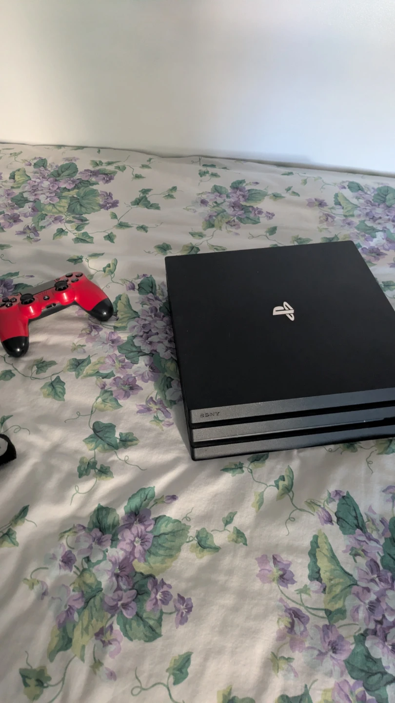 Sony PlayStation 4 Pro Console with Red Controller