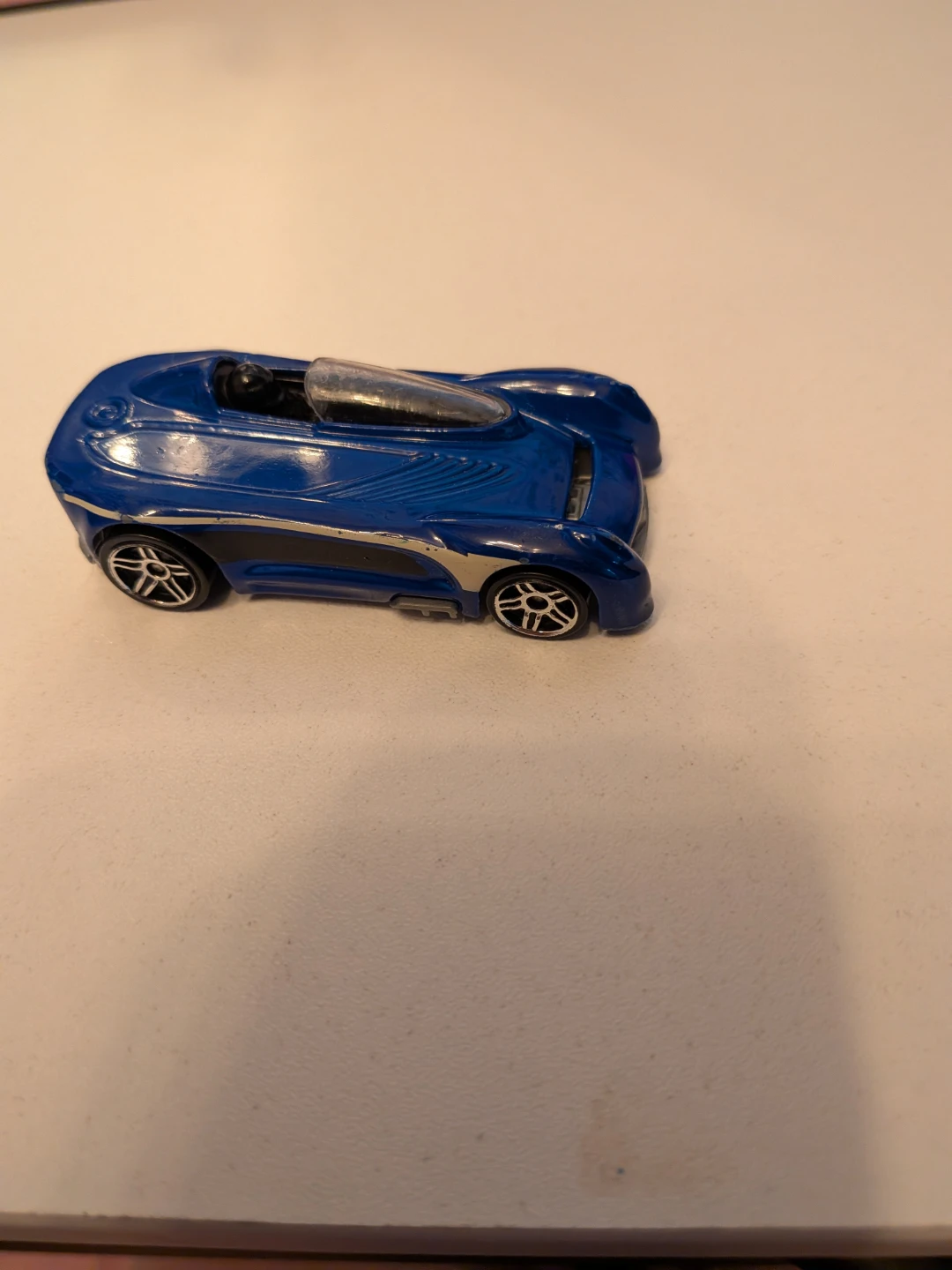 Blue Hot Wheels die-cast toy car