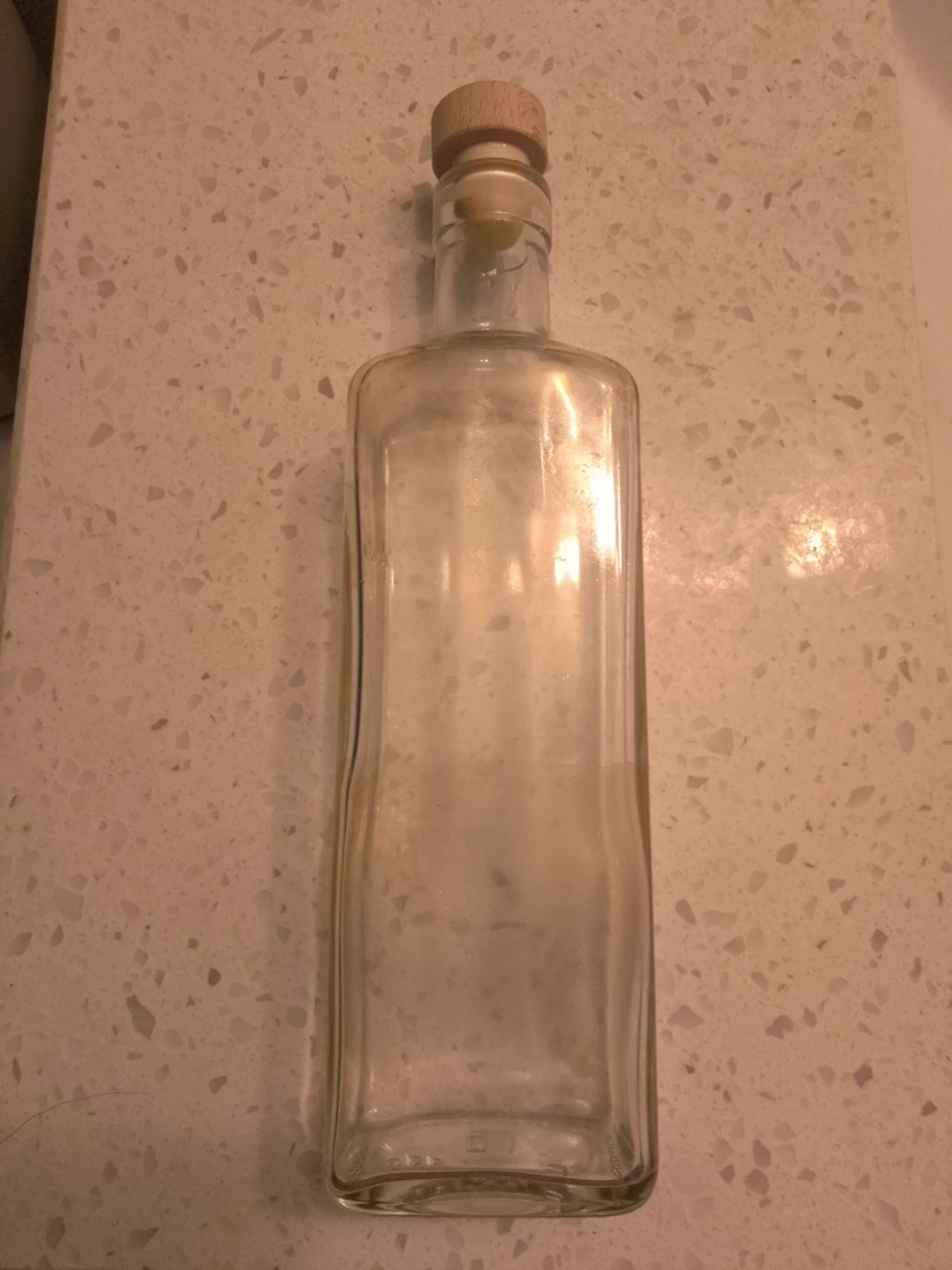 Clear glass bottle with wooden stopper 🏈