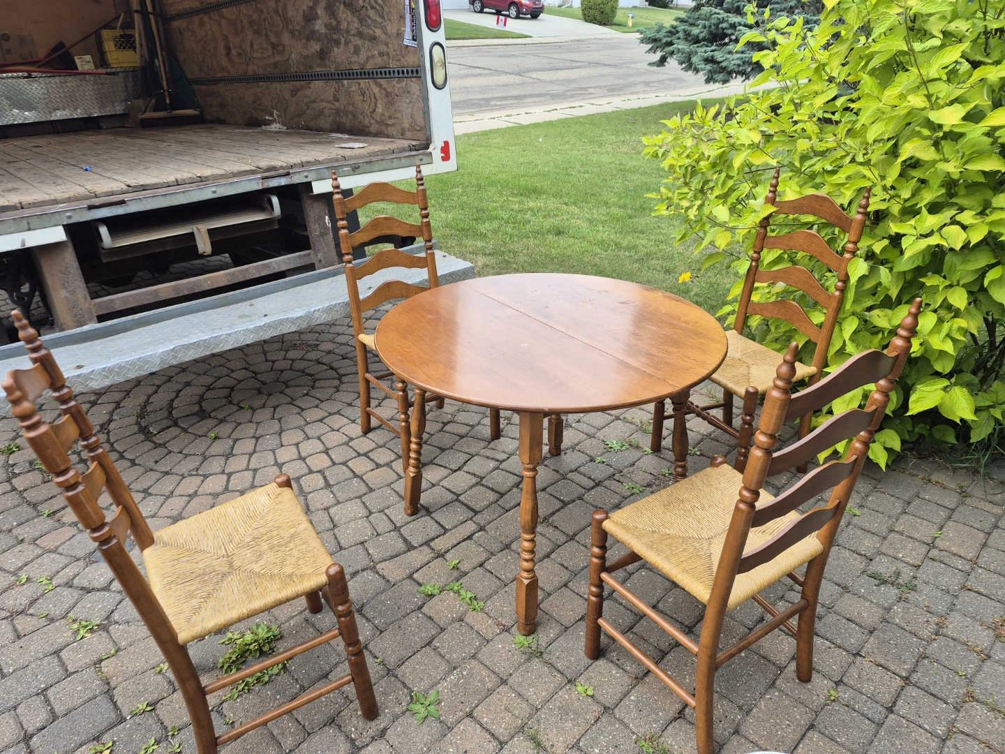 Wooden Dining Table with Four Ladder-Back Chairs - photo 2
