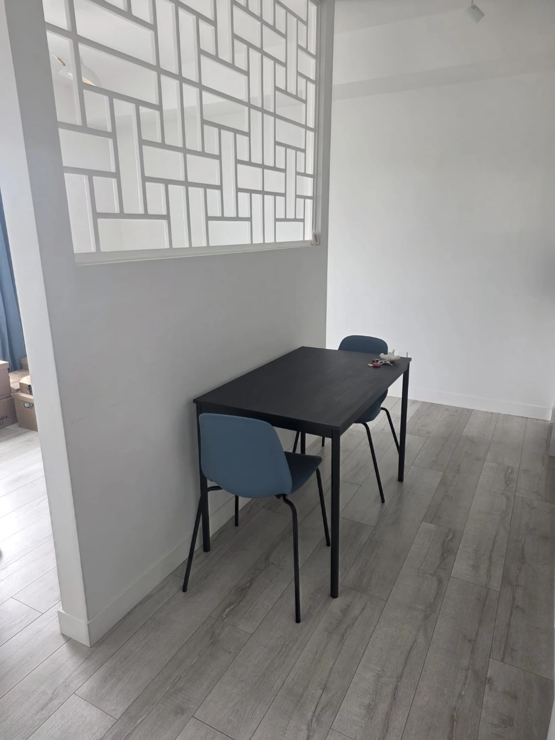 Black Table and Two Blue Chairs