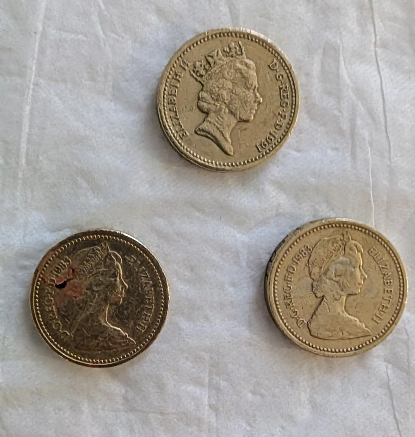 Three British One Pound Coins