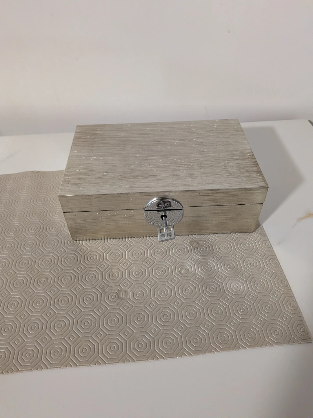 Wooden jewellery box with key.