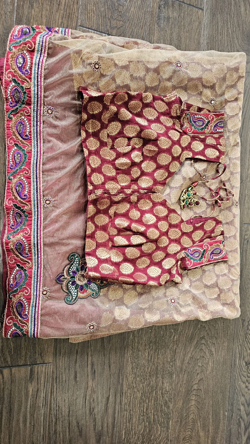 Beautiful two tone maroon and cream saree with half net.