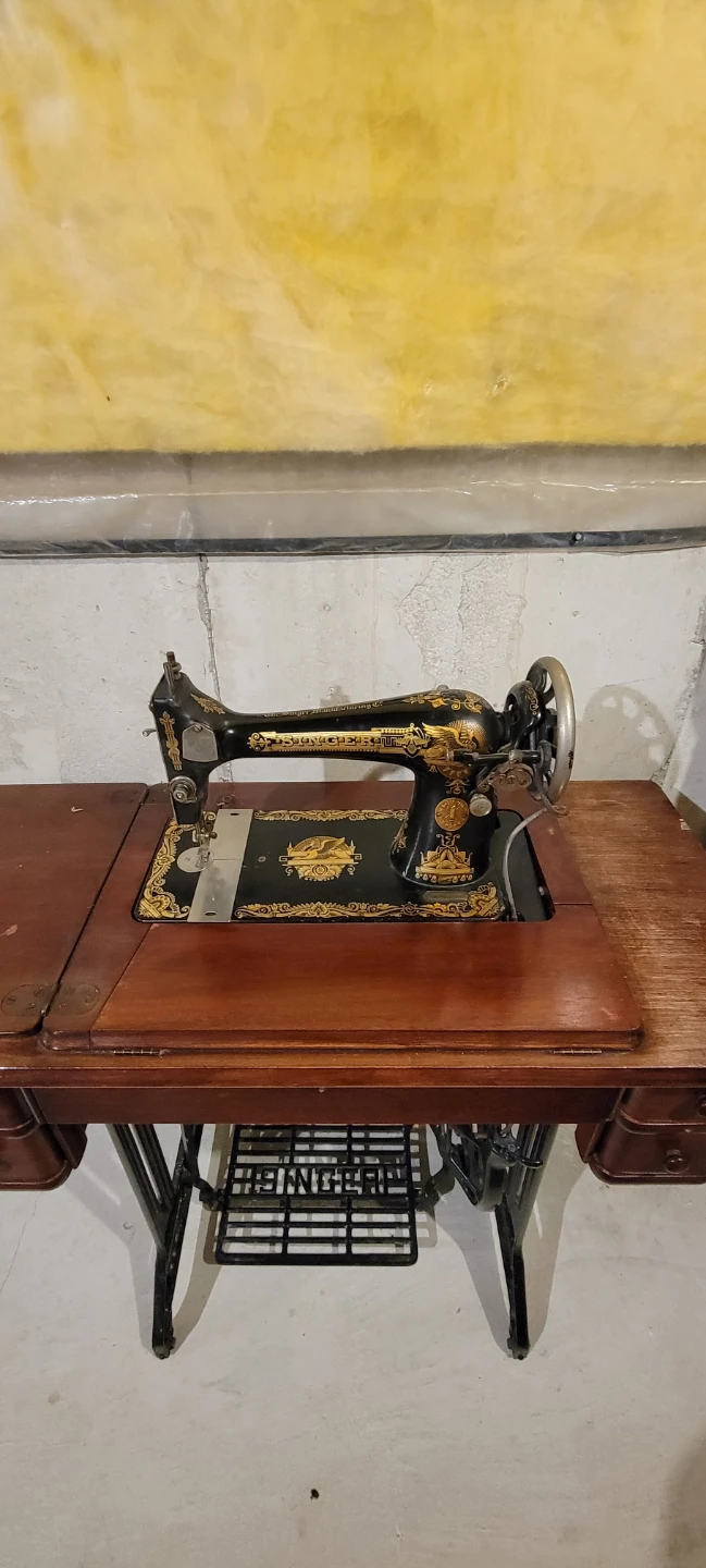 Antique Singer sewing machine with cabinet