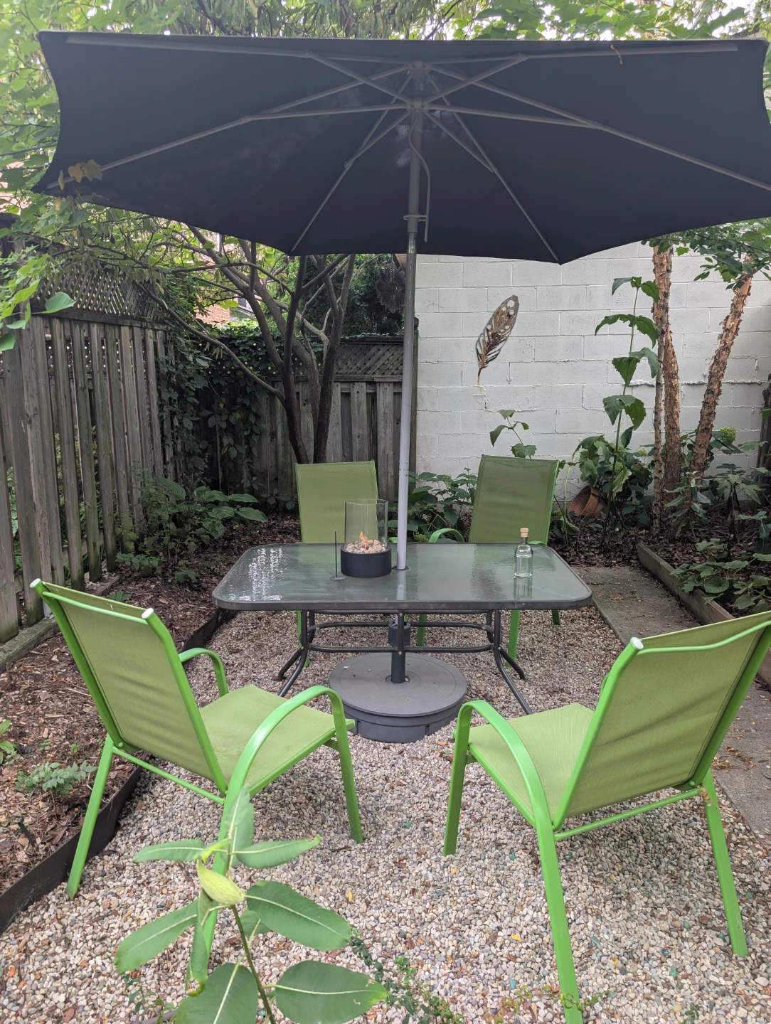 Outdoor patio set with table, 4 chairs, and umbrella