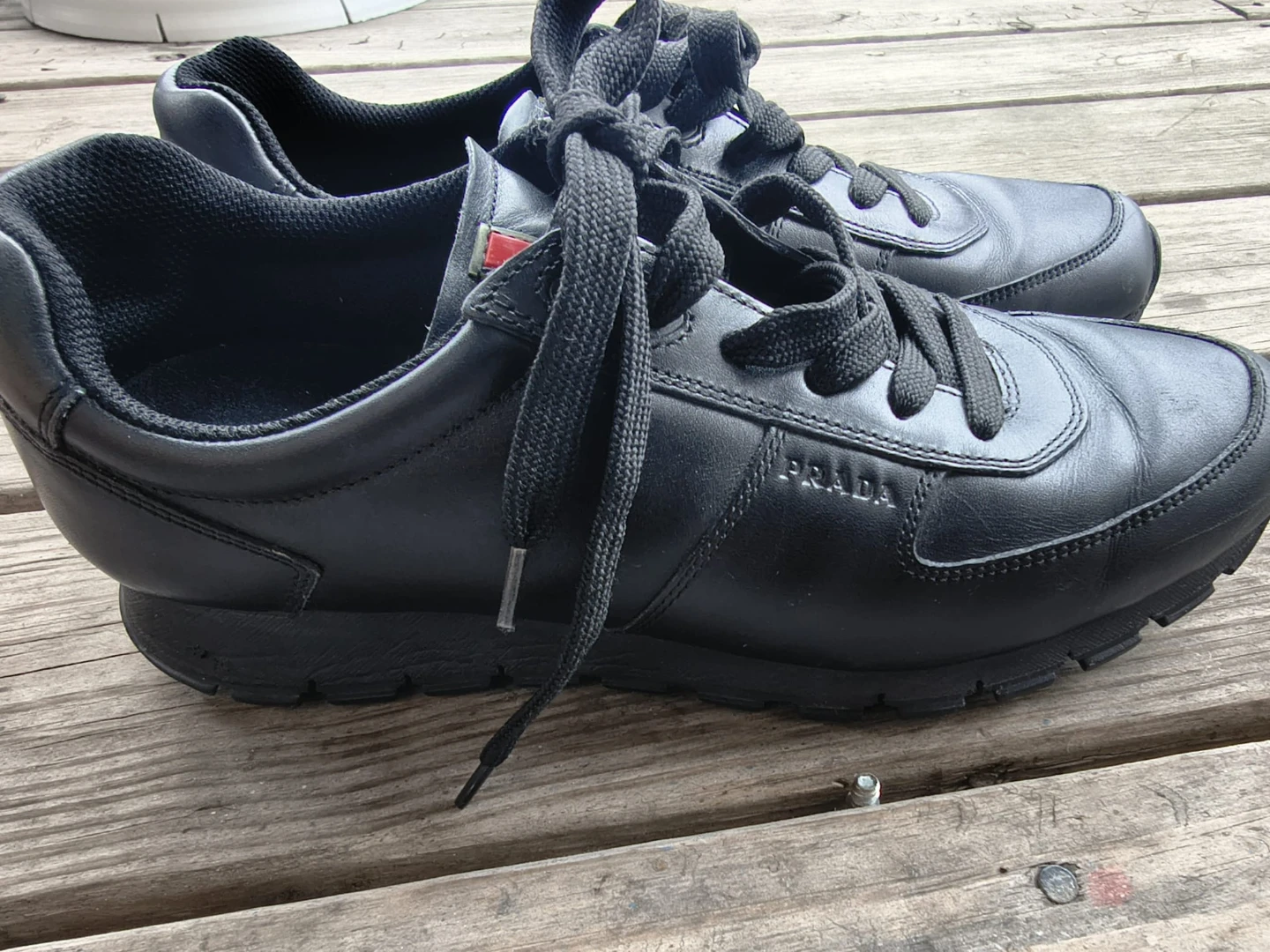 Prada black leather sneakers