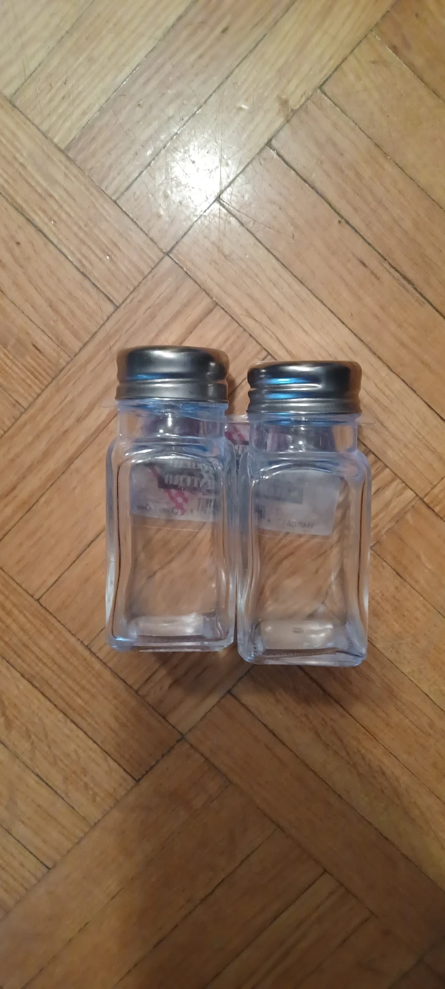 Two glass salt and pepper shakers 🏈