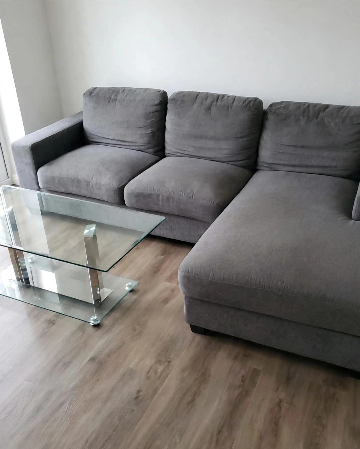 Modern L-Shaped Grey Sectional Sofa And Glass Coffee Table