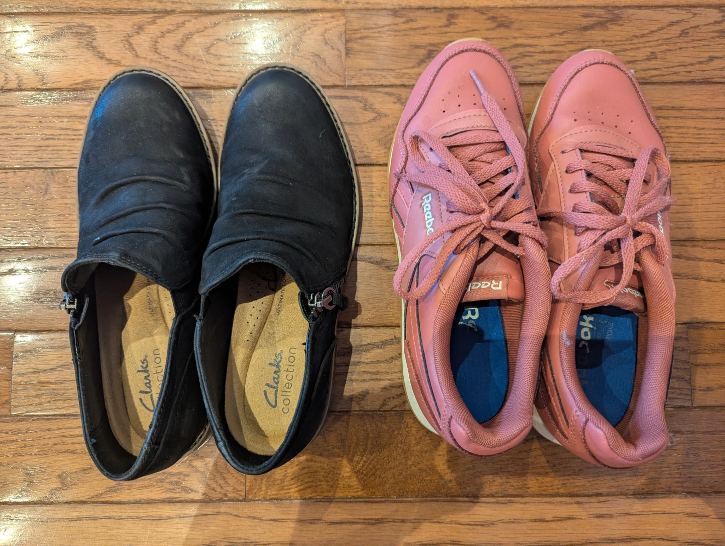 Two pairs of women's shoes: Clarks and Reebok