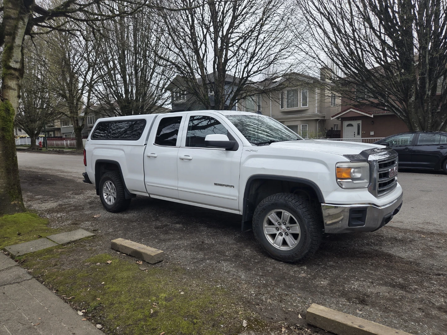 White GMC Sierra Truck with Cap