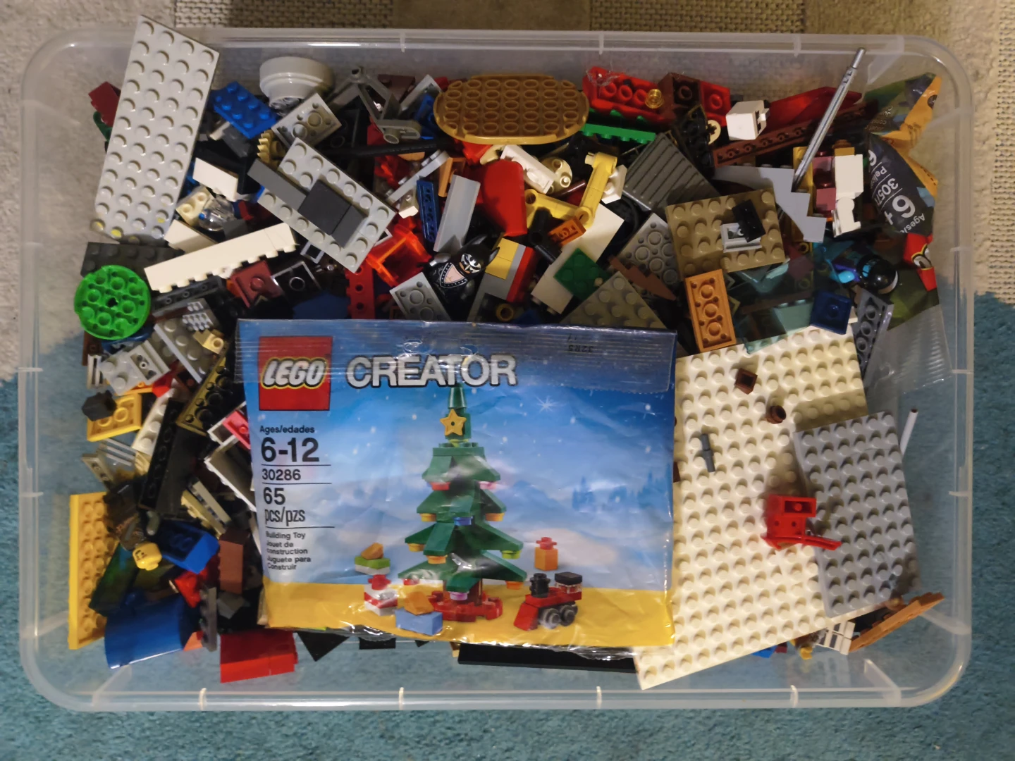 Assorted LEGO bricks in storage bin