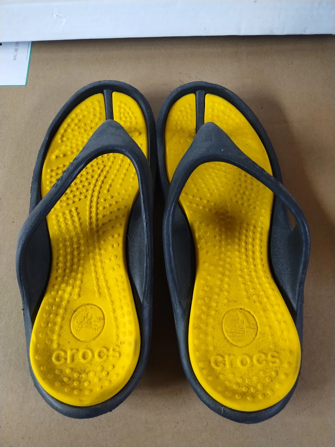 Crocs flip flops yellow and black