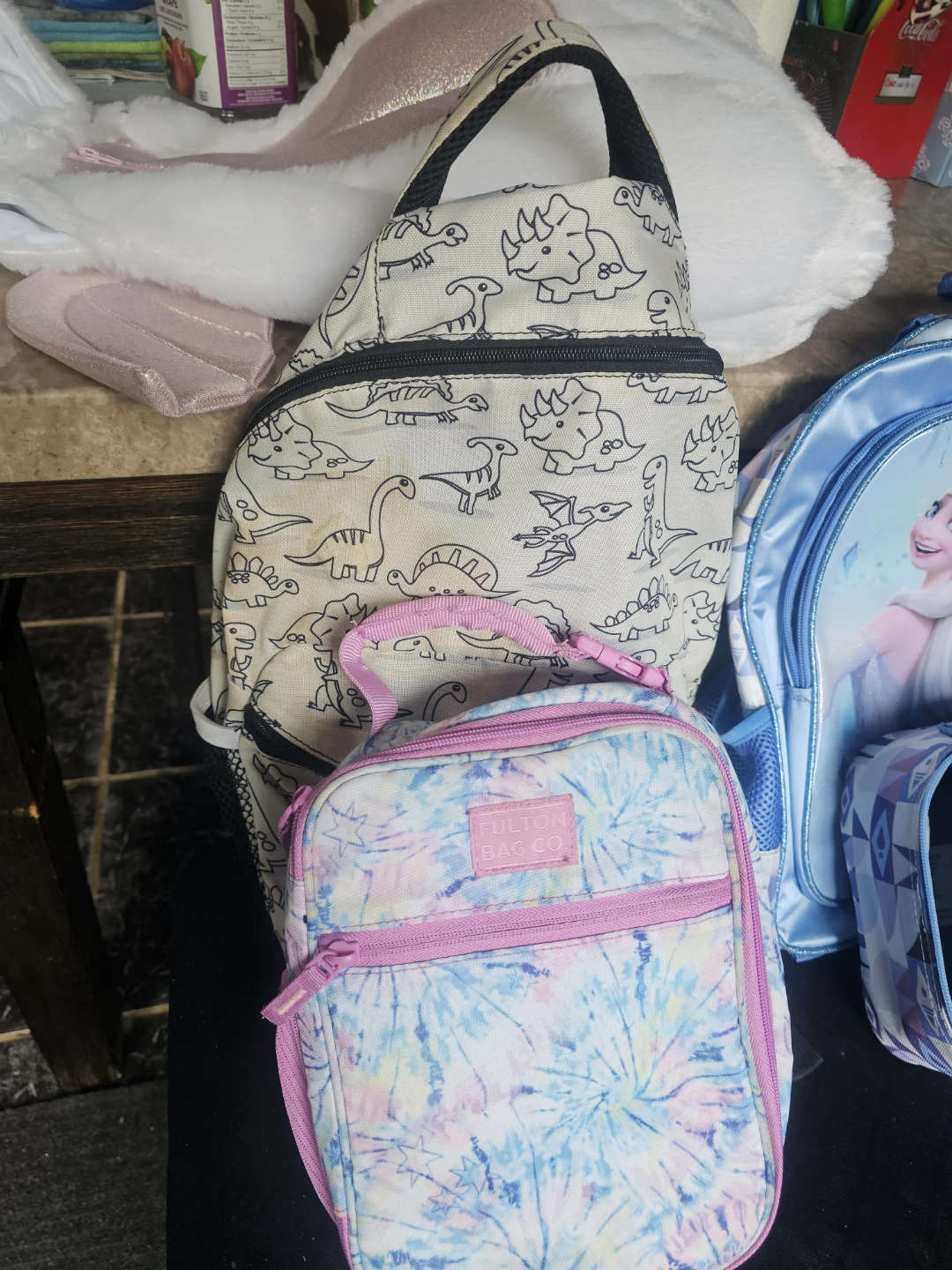 Assortment of kids backpacks and lunch bags