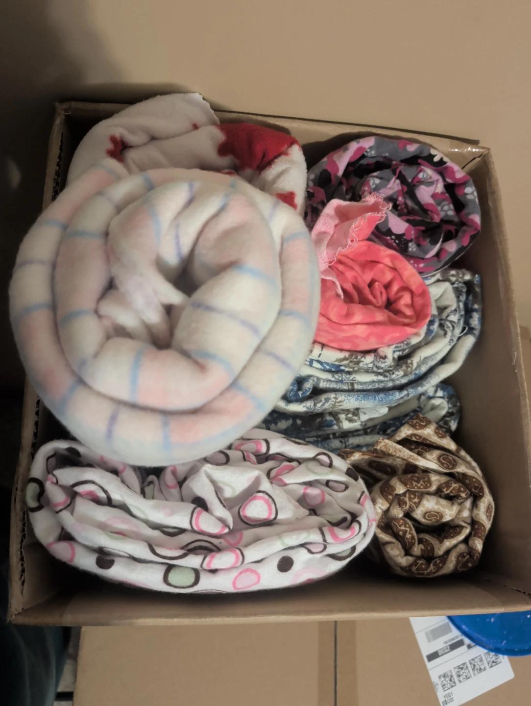 Box of assorted fleece and flannel