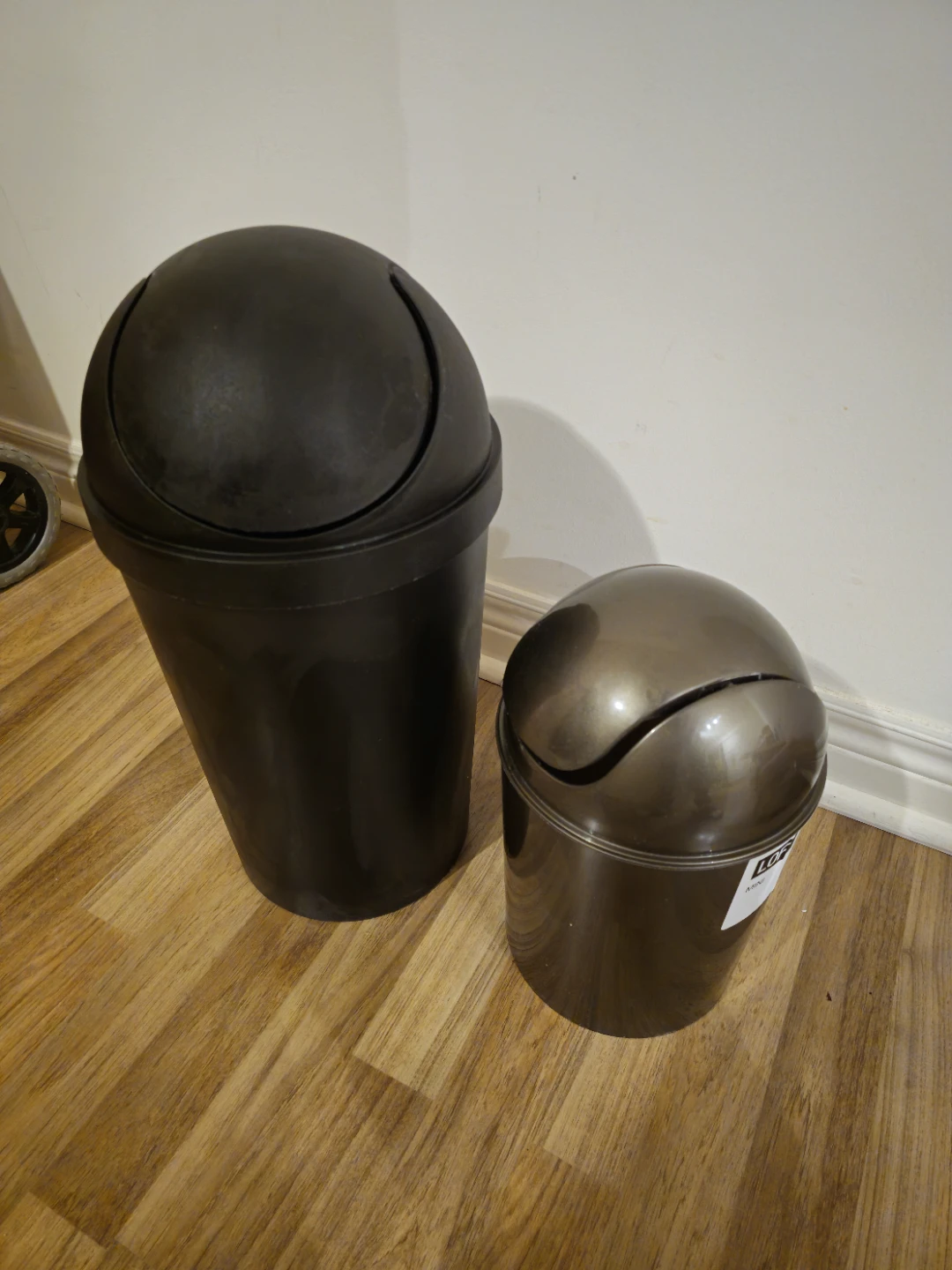 Two swing-lid waste bins