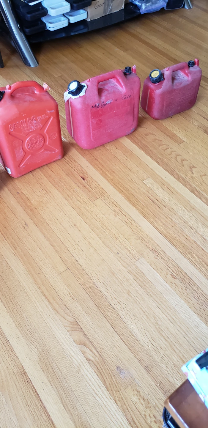1 Large 25 L or 10 gals  red gasoline fuel container. C/W nozzle
