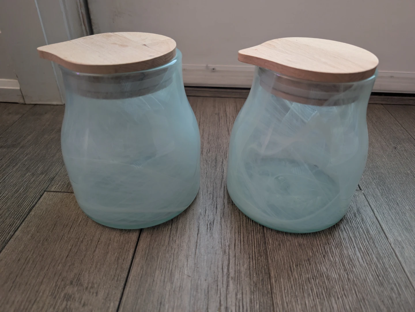 Set of Two Swirl Glass Jars with Wooden Lids