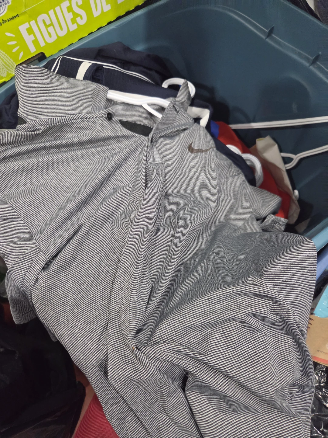 Two bins of brand name mens tops