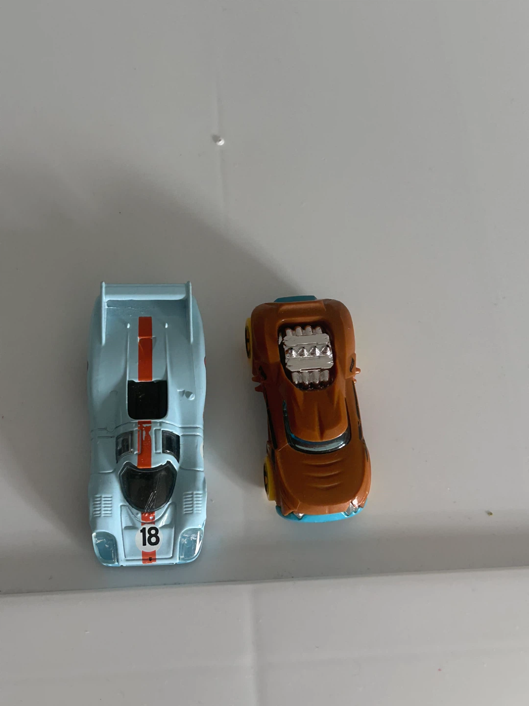 Two Hot Wheels die-cast toy cars