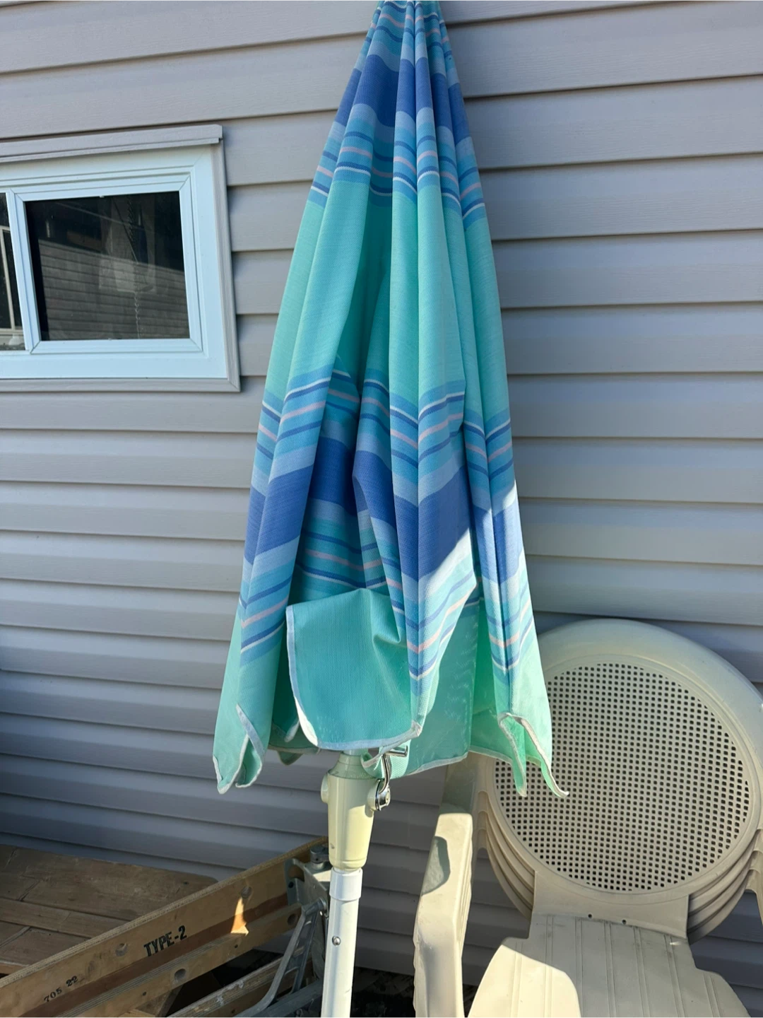 White Plastic Patio Chair with Striped Cushion