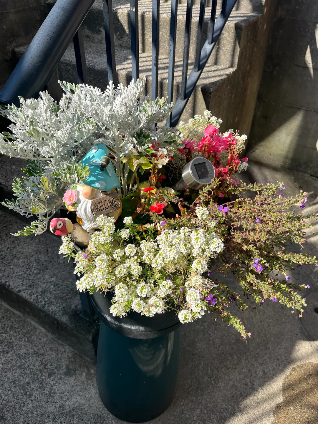 Garden planter with gnome and solar light