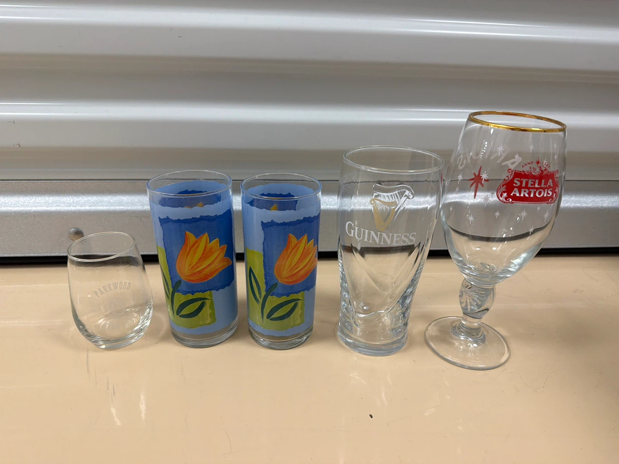 5 Assorted Glasses: Guinness, Stella Artois, Parkwood, Floral
