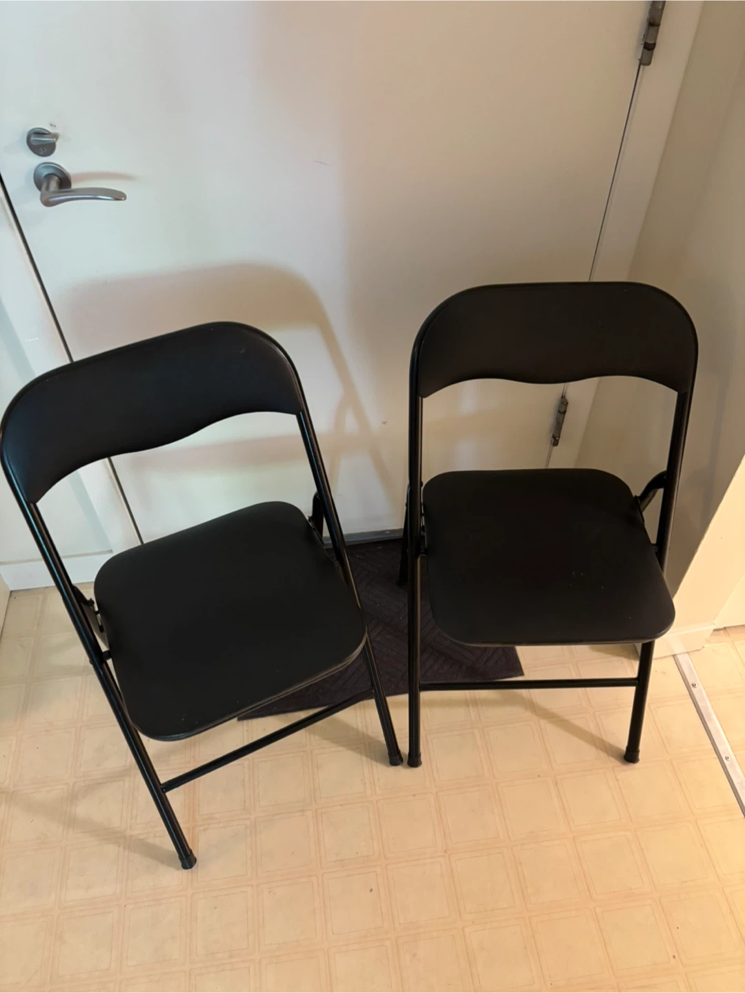Two Black Folding Chairs