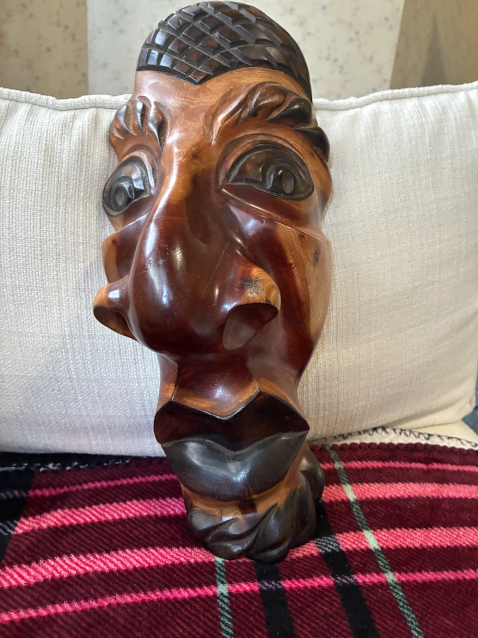 Hand-carved wooden wall mask