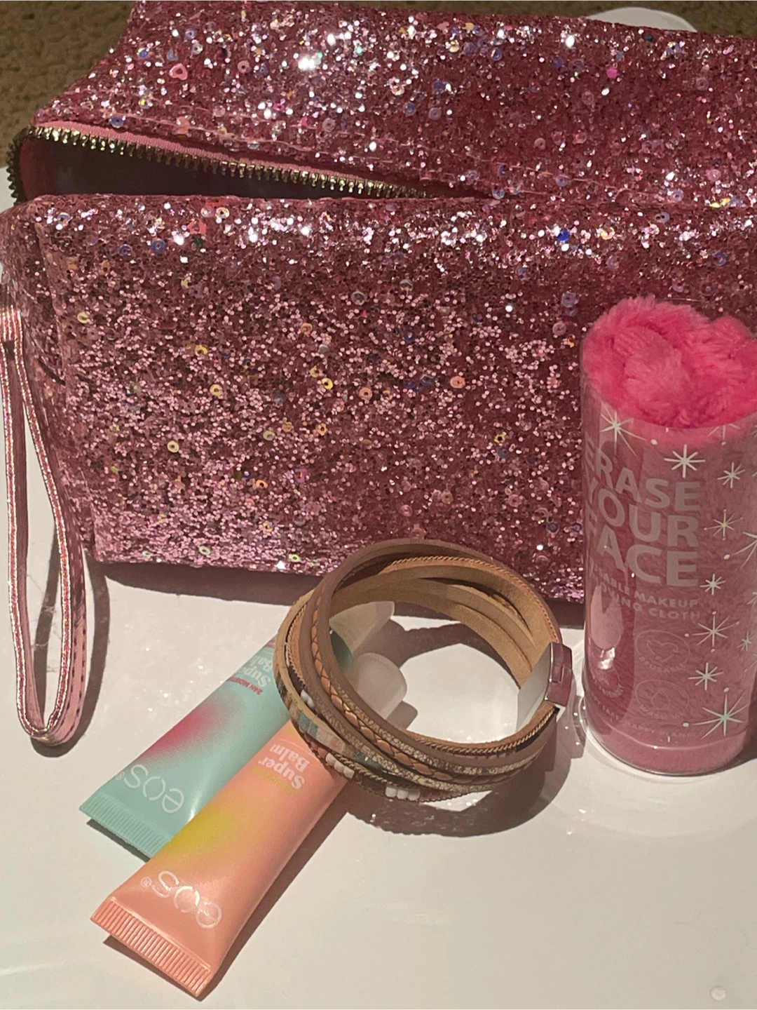 Set: Glitter Pouch, Eos Balms, Bracelet, Makeup Cloth