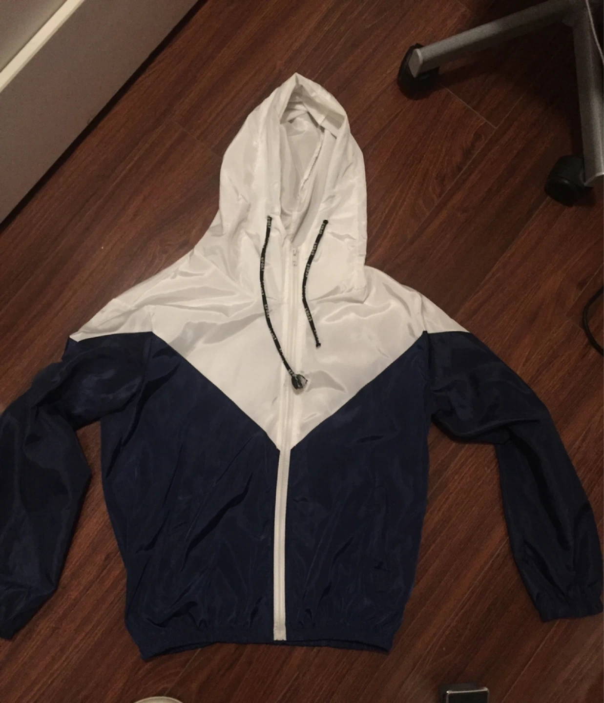 White and navy blue windbreaker jacket