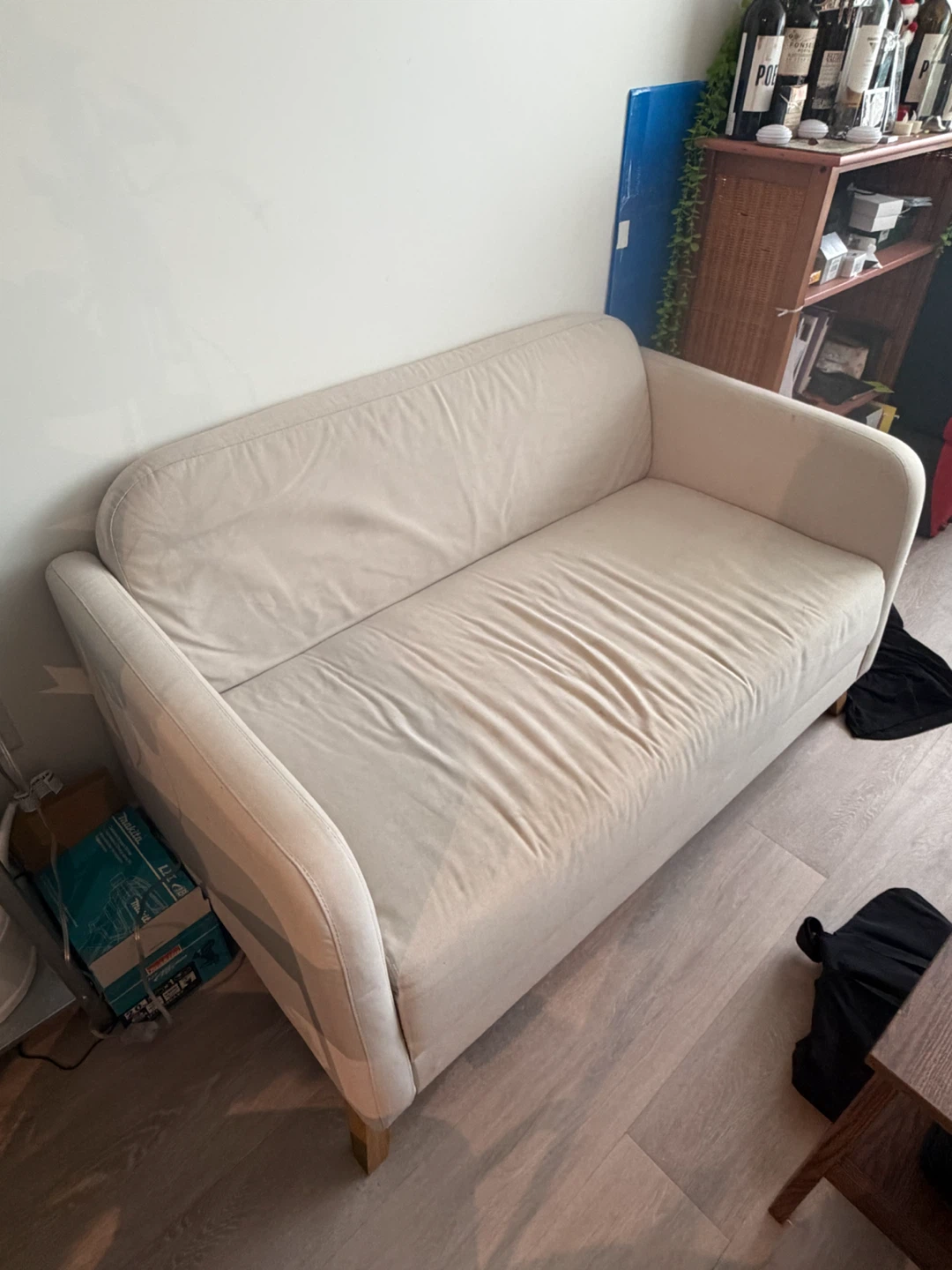 Beige two-seater sofa