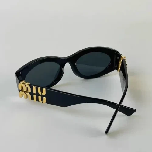 Miu Miu Black Oval Sunglasses with Gold Logo - photo 4