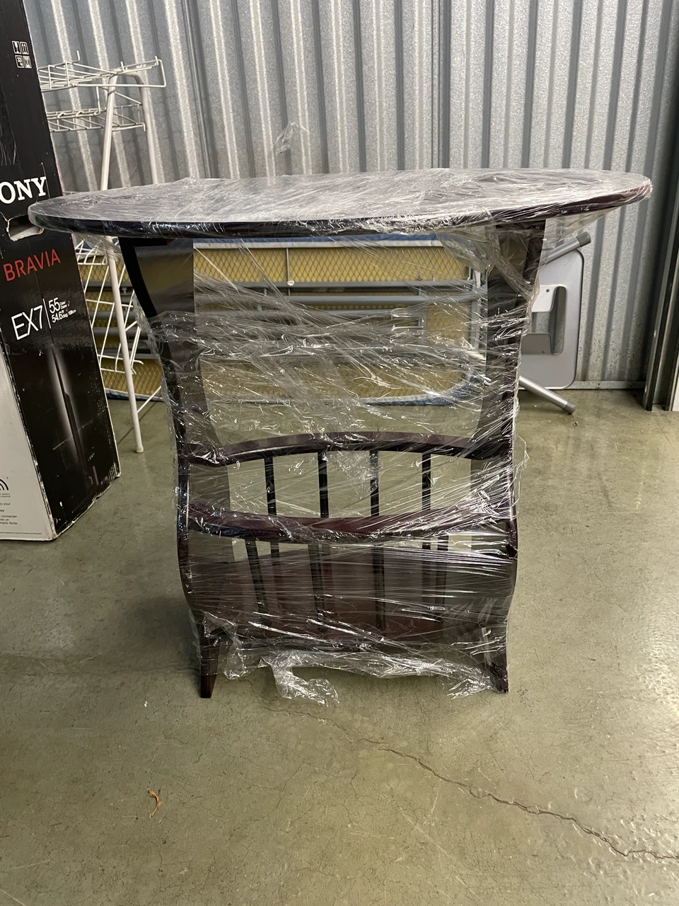 Oval Side Table with Magazine Rack