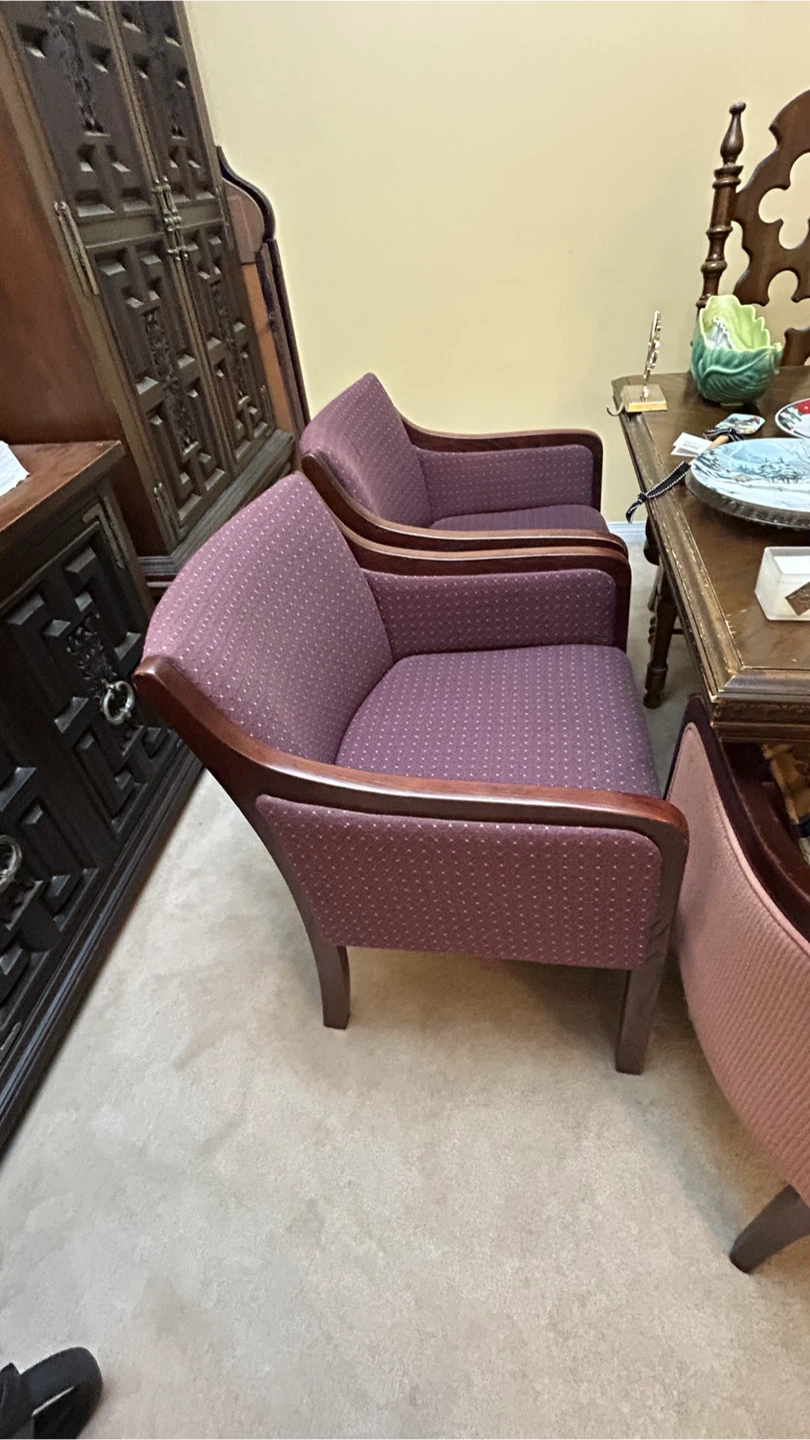 Purple upholstered accent chairs with wooden trim