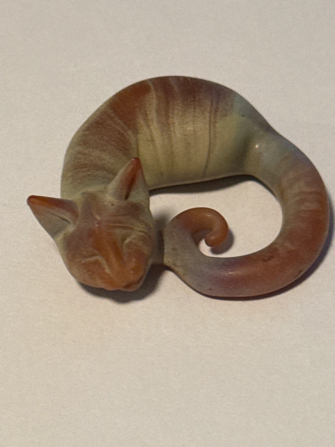 Small sleeping cat figurine